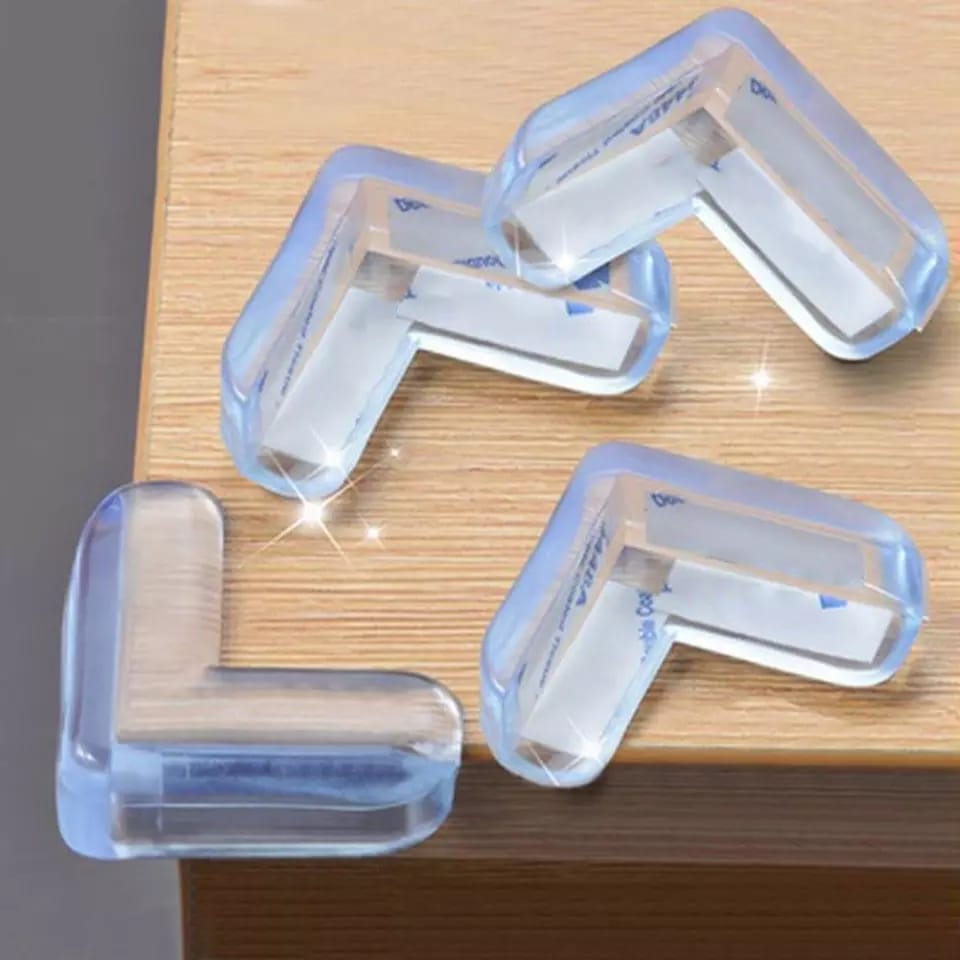 Clear silicone corner protectors on a wooden surface